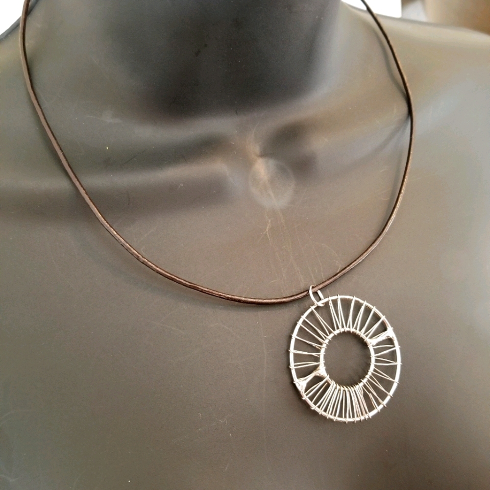 Beautiful circle peice on new leather necklace